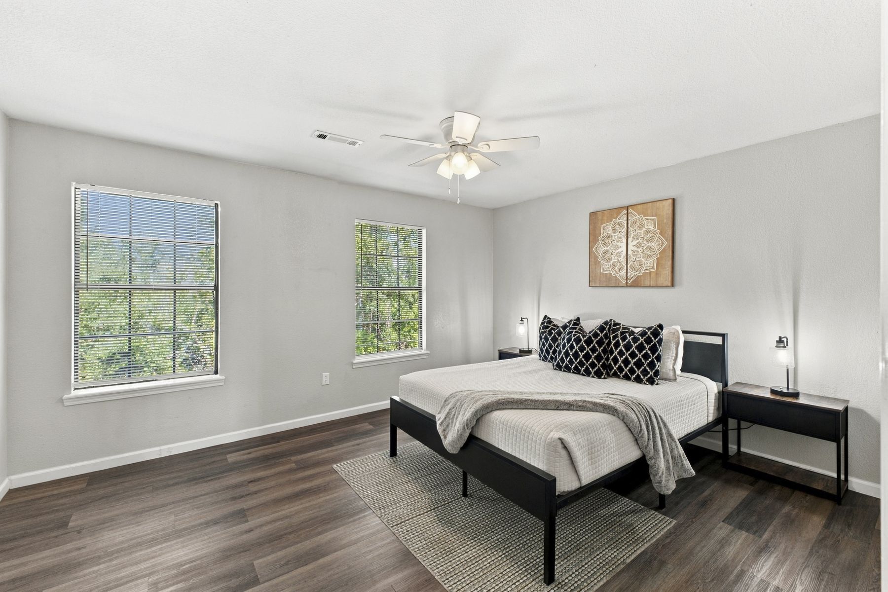 Unit B bedroom with platform bed and workspace