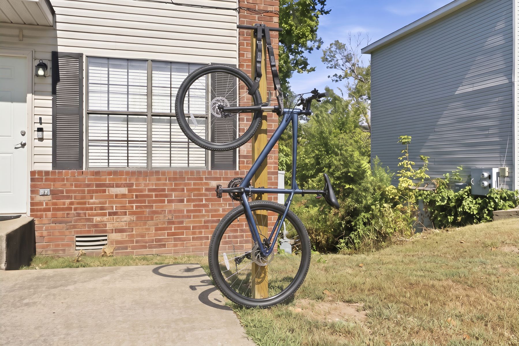 A mountain bike leaned at the entry to unit A