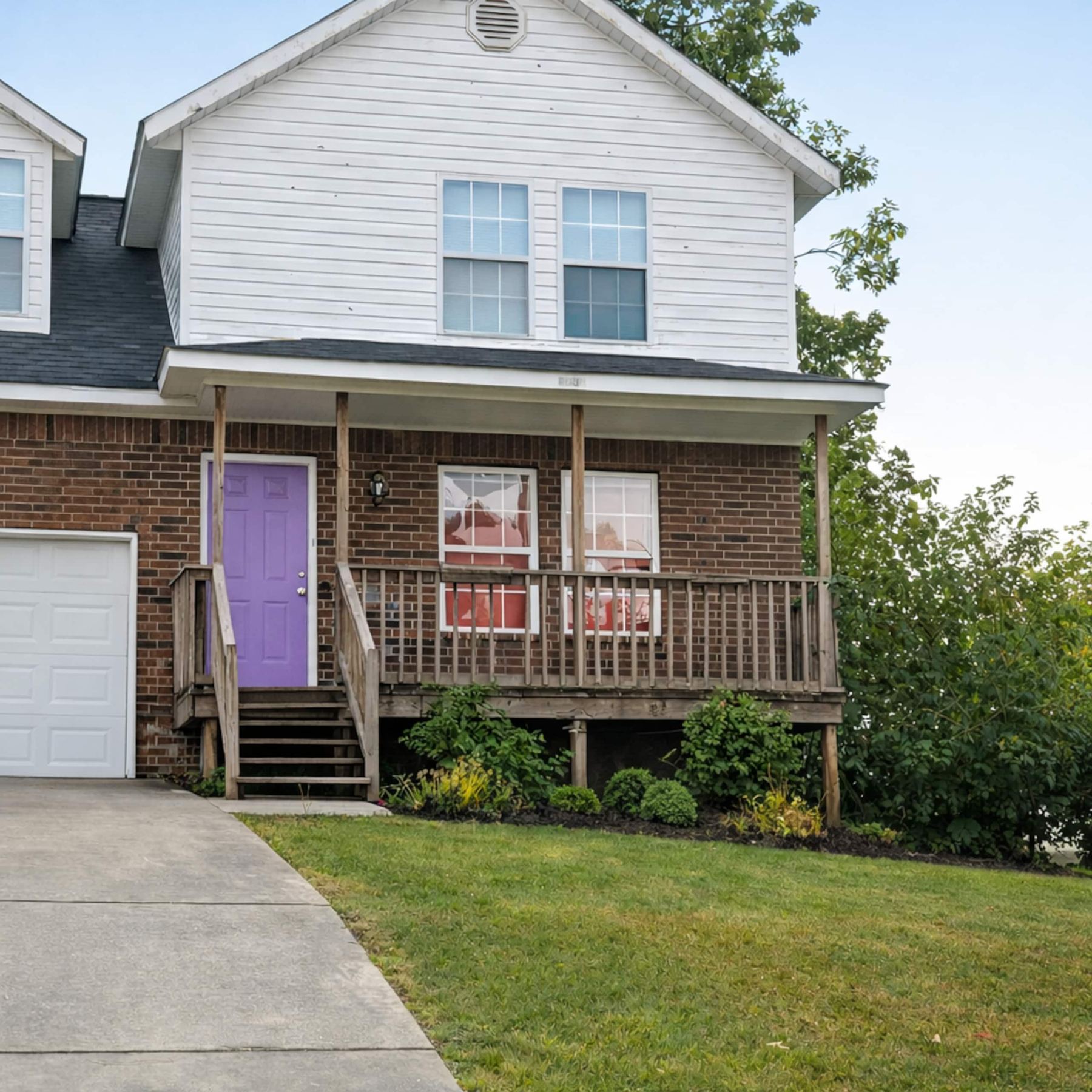 Camellia B exterior with its purple front door